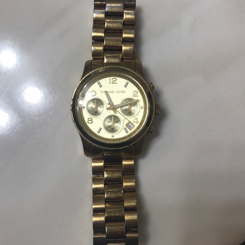 Used MK gold watch.